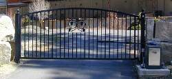 Automatic Drive Gate With Large Rocks On Each Side Of The Gate